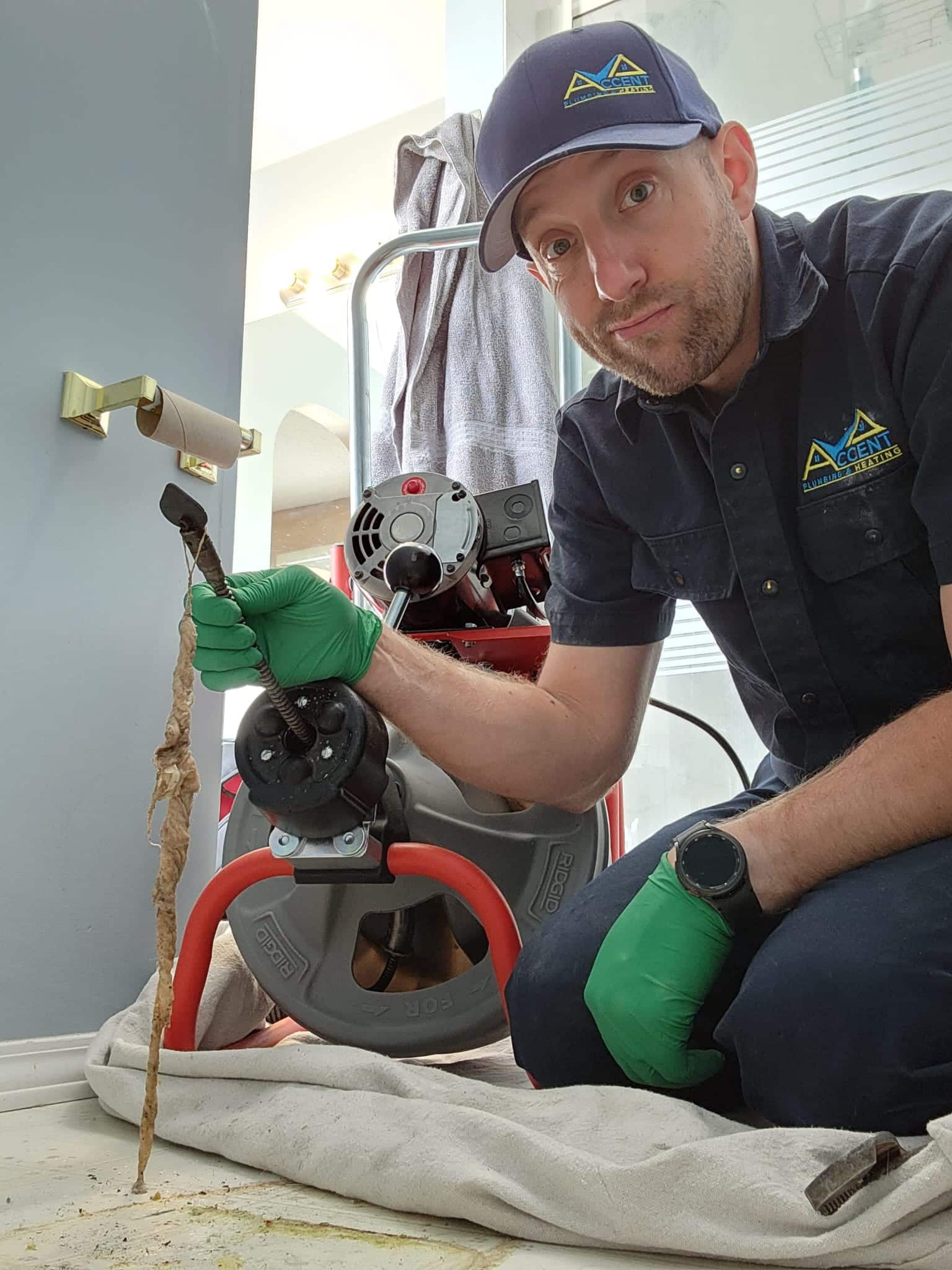 Ben from Accent Plumbing and Heating clearing a blocked drain