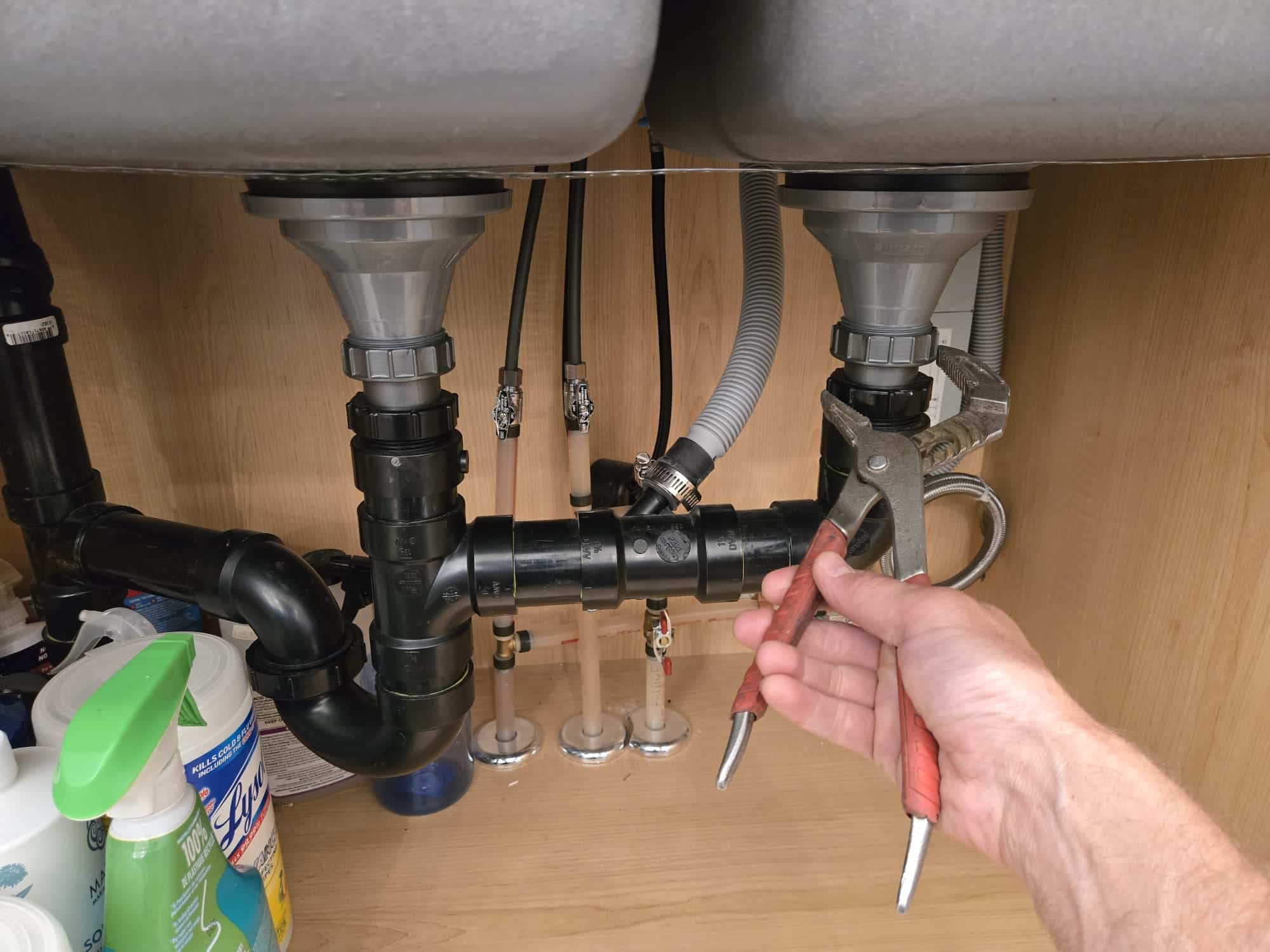 New drain pipework under a double kitchen sink, fitted by Accent Plumbing and Heating